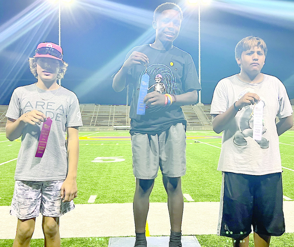 Clinton seventhgrader Rayden Walker finishes a tackle during a recent