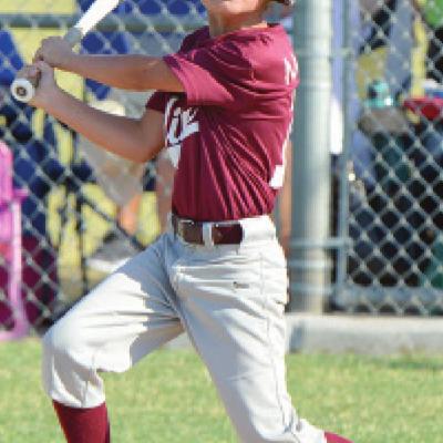 Karsten Moore of the Clinton Maroons hits a shot to the outfield against Hobart. CDN | Josh Jennings Clinton rallies in Hobart defeat