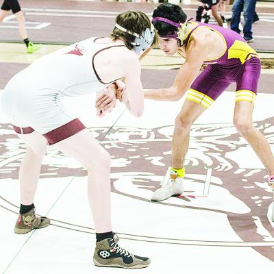 Clinton’s Vicente Gutierrez, right, grapples with his opponent during the District Duals at Elk City. CDN | Sam Goodwyn