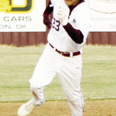 Clinton’s Daniel George barrels his way to third base during the home opener against Western Heights this season. CDN | Emily Stephens Senior quickly bonds with new teammates