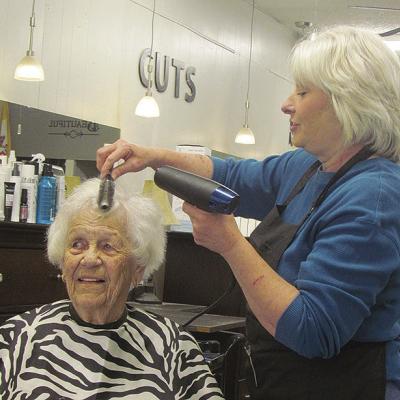 Jennifer Vowell tends to the hair of Wilma McGregor at Scissor Talk hair studio in Clinton. CDN | Christian Jacobsen