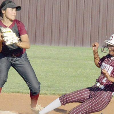 Jaiden Begay slides into second base and breaks up a double play. CDN | Josh Jennings CHS softball wins Bi district at Classen SAS