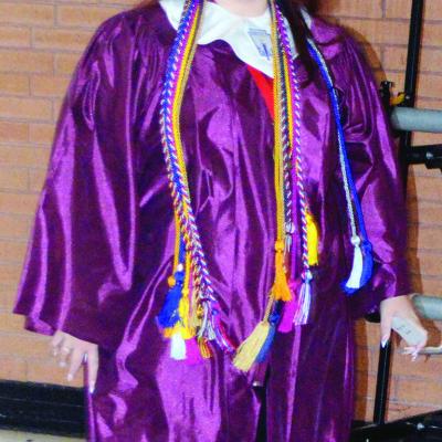 Abigail Williams stands excited to have her senior graduation ceremony at the Tornado Dome. CDN | Christian Jacobsen