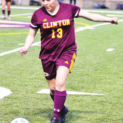 CDN | Collin Wieder Clinton senior defender Elizabeth Trejo dribbles the ball, before clearing it off the back line against Putnam City North.