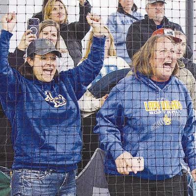 Amber Lee, left, and Kyla Garibay show their excitement following the final out as the Arapaho-Butler Lady Indians slowpitch softball team defeated Caddo 13-2 at the FireLake Ball Fields to capture the title. CDN | Sam Goodwyn