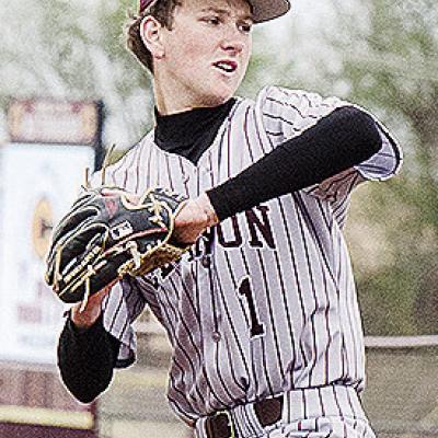 Clinton’s Jeter King goes into his wind up Friday as he prepares to pitch during the Reds’ home game against Kingfisher. CDN | Sam Goodwyn