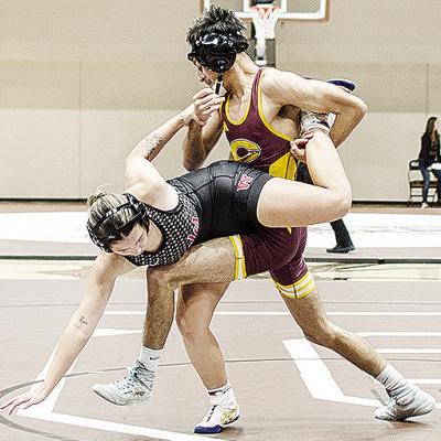 Clinton’s Brandon Rodriguez-Esclalante, right, performs a single leg takedown of his opponent during the Class 4A District 1 Duals Tuesday in Elk City. CDN | Sam Goodwyn
