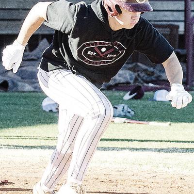 Clinton’s Vince Jones hustles away from home plate to first during a batting drill in baseball practice. CDN | Sam Goodwyn