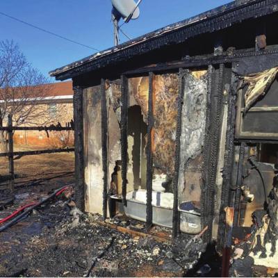 Van Buren house fire sets fence, two backyards ablaze