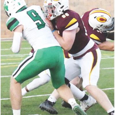 No. 66 Marcus Wilson blocks the McGuinness defender during Friday’s game against the Fighting Irish. CDN | John Kinsey Clinton prepares for Heritage Hall