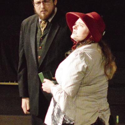 Jacob Staggs, left, as Ebenezer Scrooge, and Amy Baker as the Charity Lady act out a scene together during the Southwest Playhouse’s production of “A Christmas Chaos.” CDN | Micah Ashcraft