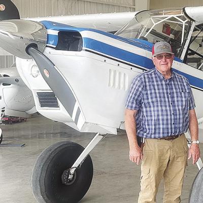 Greg Little from Carnegie, stands next to one of his aircraft being housed at the Clinton Regional Airport. CDN | Shiann Dawson