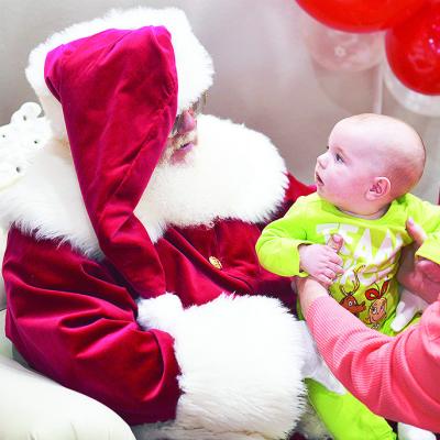 Tripp Mandrell meets Santa Claus at the Pepsi Event Center during the Clinton Festival of Lights. CDN | Micah Ashcraft Tripp Mandrell meets Santa Claus at the Pepsi Event Center during the Clinton Festival of Lights. CDN | Micah Ashcraft