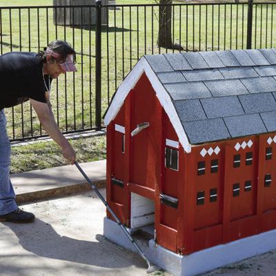 Tony Wilson works in preparing the miniature golf course for new greens at McLain Rogers Park. CDN | Michael Maresh