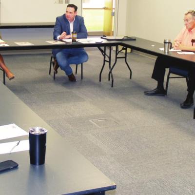 Clinton City Councilmen (clockwise) Ernie Dowdell, Patch McComas, Mayor David Berrong, OML’s Jodi Lewis and Mike Fina, Councilmen Bobby Stewart and Chris Jones discuss the search process needed to find a new city manager.
