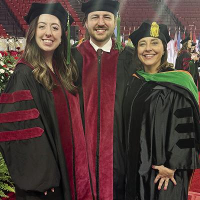 From left, Dr. Laramie Knapp, Dr. Gavin Knapp, and Dr. Stacy Knapp pose during the University of Oklahoma’s recent graduation. Stacy, as a practicing physician and by the tradition of welcoming a new physician to the profession, was able to “hood” h