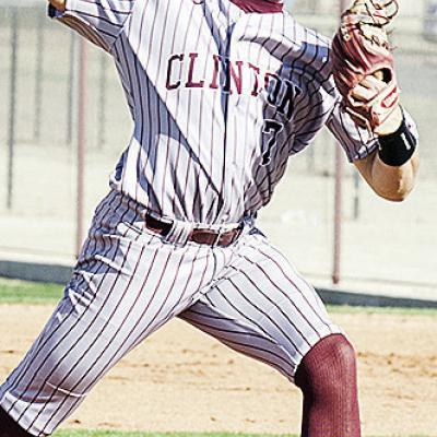 Clinton’s Easten Powell hurls the pitch during the Reds’ narrow win Friday at home over El Reno. CDN | Sam Goodwyn
