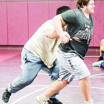 Clinton’s Isaiah Dustman, right, breaks free of Sammy Zheng’s grasp during an open gym practice over winter break in the wrestling room. CDN | Sam Goodwyn