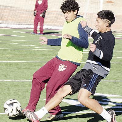 Clinton’s Miguel Zuniga Hernandez, left, and Luis Velez fight for the ball during practice in the Tornado Bowl. CDN | Sam Goodwyn