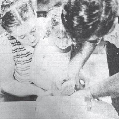 40 YEARS AGO Sgt. Ken Nunemaker of the Clinton Armory, 171st F.A. Oklahoma National Guard, manned a booth sponsored by the Cloud Chief E.H. Club at the Washita County Fair. He was making a fingerprint I.D. sheet with April, who is held by her mother Jan H CLINTON’S HISTORY 10, 20, 30 AND 40 YEARS AGO