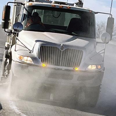 Fred Huber with the City of Clinton operates the street sweeper on Fourth Street to help remove some of the salt and grit used on roads last week. CDN | Michael Maresh