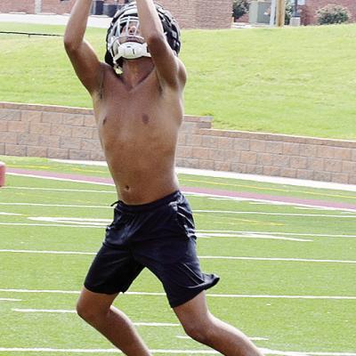 CJ Begay grabs the ball out of the air in an interception drill during practice. CDN | Sam Goodwyn