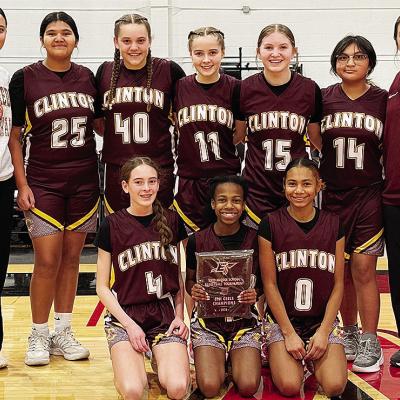 Clinton’s seventh-grade girls’ basketball team is all smiles after winning the Enid eighth-grade basketball tournament. Pictured, from left, kneeling are Madilyn Ruyle, Kynnedi Jefferson and Catileya Huddlen; back, Coach Mariah Espinosa, Daniaya Redsh