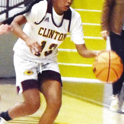 Arianna Spottedwolf dribbles the ball during a Clinton Middle School seventh-grade basketball game. CDN | Emily Stephens Rising Stars