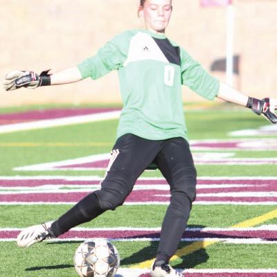Clinton goalkeeper Audrey Shackelford puts a ball in play during the first half of the Lady Reds’ 8-2 triumph over Harding Charter Prepatory. CDN | Adam Ewing Lady Reds take fifth-straight match