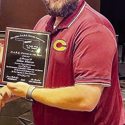 Clinton Police Department School Resource Officer Dillon Whitten accepts the D.A.R.E. Officer of the Year Award. CDN | Courtesy photo Clinton Police Department School Resource Officer Dillon Whitten accepts the D.A.R.E. Officer of the Year Award. CDN | Courtesy photo