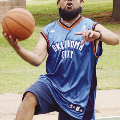 Jonathan Mejia goes up for the basket during two-on-two basketball Tuesday afternoon at the McLain Rogers basketball court. CDN | Christian Jacobson