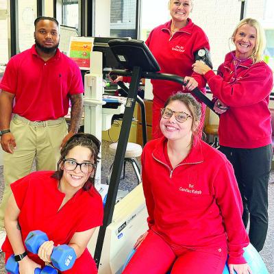 Front from left, Janie Arnett, Brianna Bowers; back, Daylan Thompson, Jina Kilpatrick, and Andrea Hammer smile while testing out equipment in the Cardiac Rehab Center at the hospital. CDN | Shiann Dawson