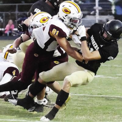 Clinton’s Ben Daugherty levels the Woodward ballcarrier during the Red Tornadoes’ win over the Boomers Thursday in Woodward. CDN | John Kinsey