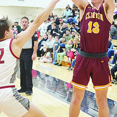 No. 13 Ethan Lofland shoots over an Eagles defender during Clinton’s road game in Weatherford. CDN | Sam Goodwyn