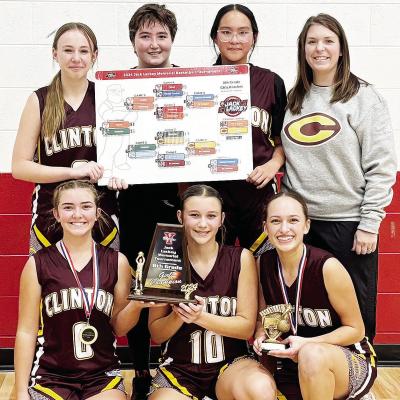 The Clinton Middle School eighth-grade team is all smiles after taking home the championship during the recent Jack Lackey Memorial Basketball Tournament in Yukon. Pictured in front, from left, are Laney Anderson, Hadley Meget, and Paisley Ruyle; back, Ma The Clinton Middle School eighth-grade team is all smiles after taking home the championship during the recent Jack Lackey Memorial Basketball Tournament in Yukon. Pictured in front, from left, are Laney Anderson, Hadley Meget, and Paisley Ruyle; back, Ma
