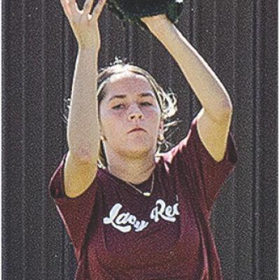 Emily De La Rosa secures the ball in her glove during softball practice at the high school softball field. CDN |Sam Goodwyn