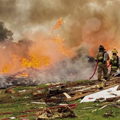 # 3 Two Die in Home Explosion