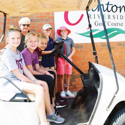 The Clinton Public School Foundation’s annual golf tournament will be held at Riverside Golf Course. Pictured are, from left, Stella Meacham, Leah Adams, and Hadley Meget sitting inside the golf cart; CPSF President Donna Rother, Ryder Adams and Sy Fost CPSF readies itself for tourney