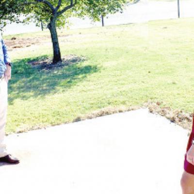 Mark Miner and Southwest Principal April Miner look at the concrete recently poured for the new gazebo reading area. Southwest Elementary set