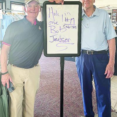 Bob Jacobson, left, smiles with Riverside Golf Pro Perry Adams after hitting a hole-in-one on hole No. 17 at Riverside Golf Course. CDN | Courtesy photo
