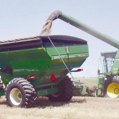 Combines converge on area wheat fields after numerous rain delays