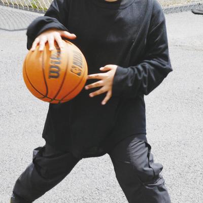 Bradly Garcia shows off his dribbling skills with a basketball at Southwest Elementary. CDN | Christian Jacobsen Bradly Garcia shows off his dribbling skills with a basketball at Southwest Elementary. CDN | Christian Jacobsen