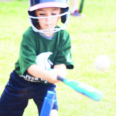 Beckham Weil sends the ball flying during his teams Clinton Noon Lions Club T-ball game last week at Acme Park. Beckham Weil