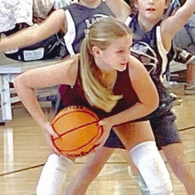 Ella Daugherty secures the basketball before getting ready to make her move. CDN | Staff photo Rising Stars