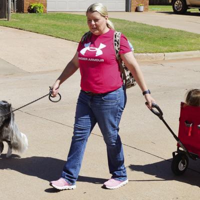 Stephanie Raab, with her dog Mayday, picks up her grandchildren Carmin and Bexleigh Raab from daycare on 25th Street. CDN | Christian Jacobsen