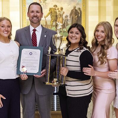 The Clinton dance team was recently honored at the State Capitol for its state title. Pictured, from left, are Coach Payten Childers, Alexandra Fuentes, Danna Mendieta, Stella Meacham, Jocelyn King, Speaker Pro Tempore Anthony Moore, Alexa Soto, Marli Hil