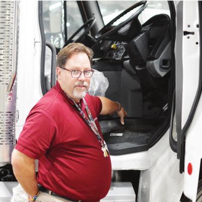 CDN | Collin Wieder Brian Aneshansley of SportChassis shows off one of the vehicles equipped with dual-steer capabilities. SportChassis benefits from state grant