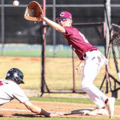 Kyler Carlisle holds a Weatherford runner on first base. The Red Tornadoes swept the series after a 12-6 win Tuesday evening. CDN | Adam Ewing Reds score 16 runs in sweep of Eagles