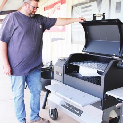 Zane Giblet checks a grill