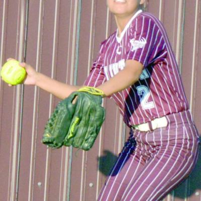 Jaiden Begay throws the ball to the infield during a recent Lady Reds softball game. CDN | Josh Jennings Begay loves playing softball for Clinton